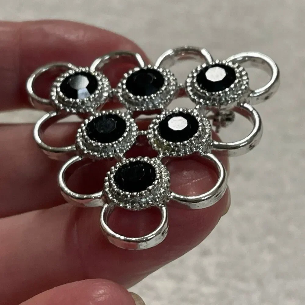 Vintage Sarah Coventry triangle open design black glass brooch
